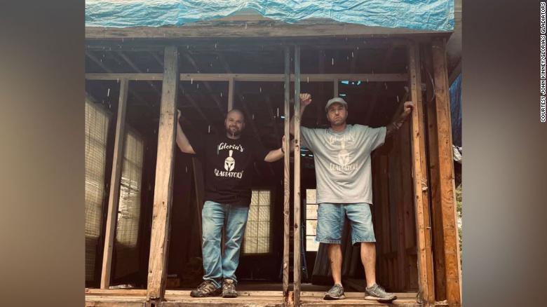 Electrician John Kinney, right, helped spark a movement to rebuild an elderly neighbor's home. 