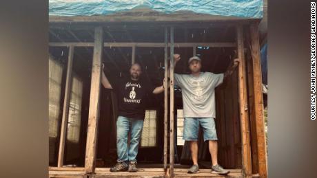 Electrician John Kinney, right, helped spark a movement to rebuild an elderly neighbor&#39;s home. 