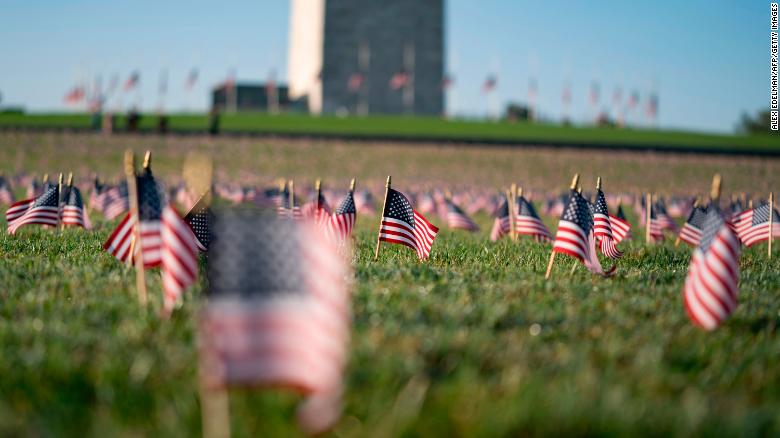 Twenty thousand flags placed on National Mall to memorialize Covid-19 deaths in the US