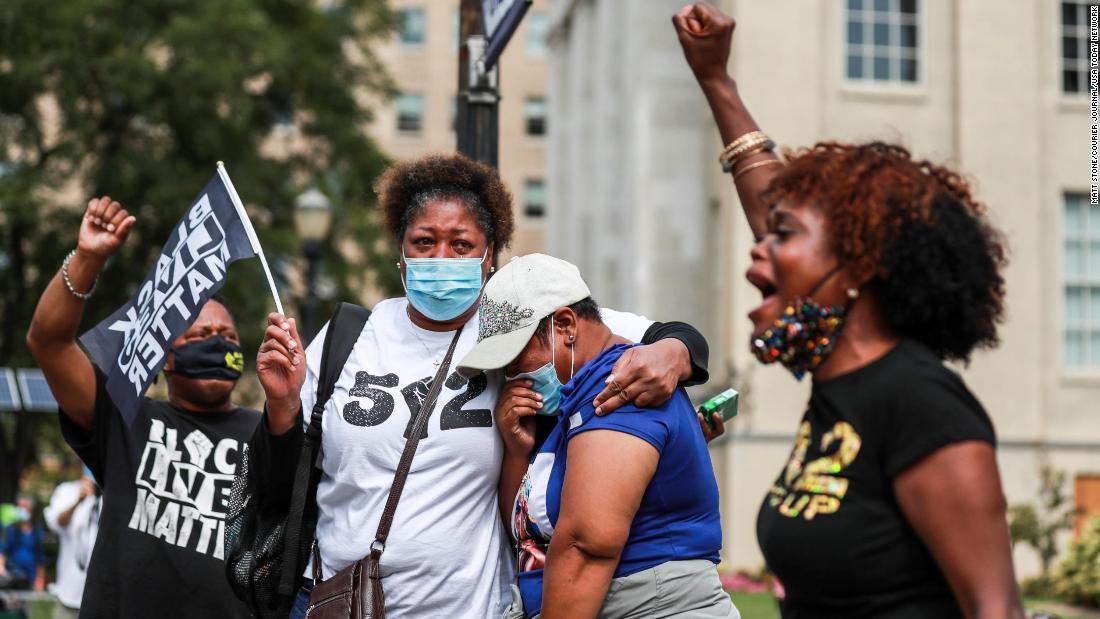 One ex-officer, Brett Hankison, faces a charge related to firing into her home. Demonstrators take to the streets.