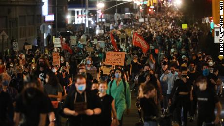 NEW YORK CITY - SEPTEMBER 23: Members of Black Lives Matters (BLM) are joined by hundreds of others during an evening protest against the Kentucky grand jury decision in the Breonna Taylor case outside of the Barclays Center on September 23, 2020 in the Brooklyn borough of New York City. Across the country, protesters have taken to the streets after the grand jury&#39;s decision to only charge one Louisville Metro Police officer in the raid in which Taylor was killed. Officer Brett Hankison, who was fired in June, was charged three counts of wanton endangerment for shooting into neighboring apartments. Bond was set at $15,000 for Hankison. Taylor, a 26-year-old emergency medical technician, was killed in her home during a no-knock raid on March 13, 2020. (Photo by Spencer Platt/Getty Images)