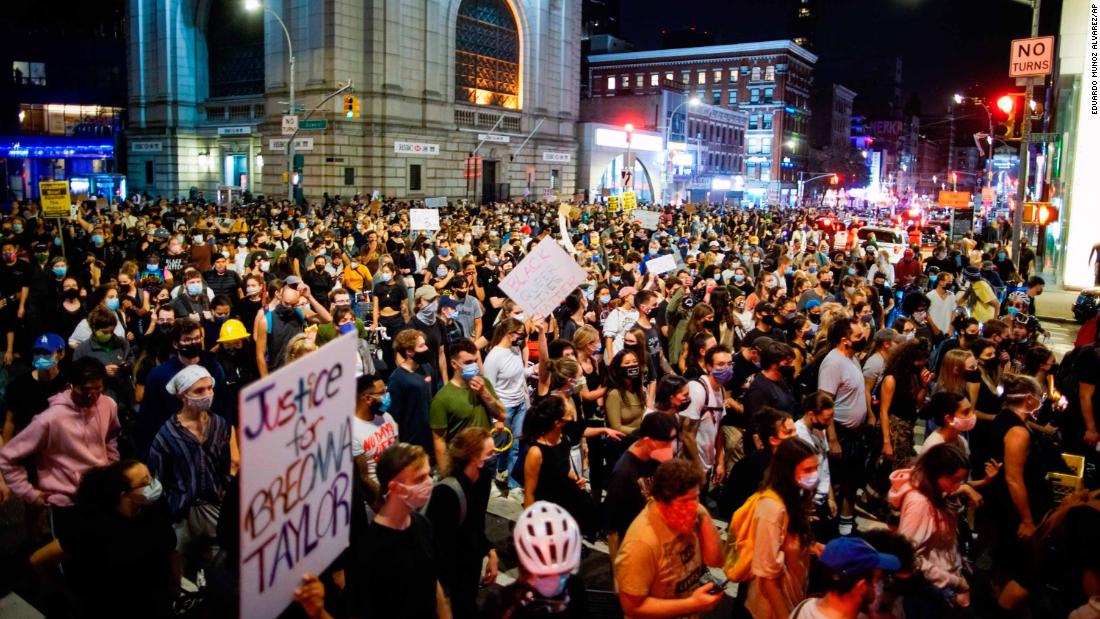 Demonstrators march during a protest in New York over a Kentucky grand jury&#39;s decision not to indict any police officers for the killing of Taylor.