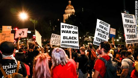 People protest the grand jury decision in the Breonna Taylor case outside the Colorado State Capitol in Denver on September 23, 2020.