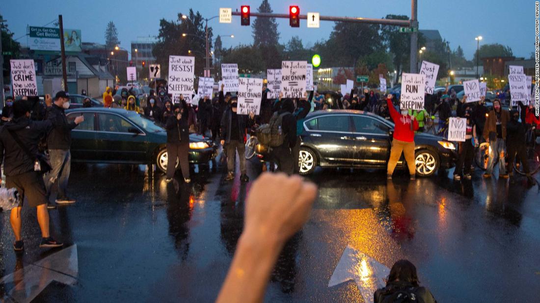 Demonstrators march and block streets in Eugene, Oregon.