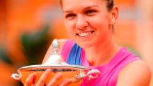 Halep poses with her trophy after winning Italian Open.