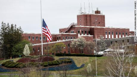 An American flag flies at half-mast outside the Holyoke Soldiers&#39; Home on April 29, 2020, in Holyoke, Massachusetts.
