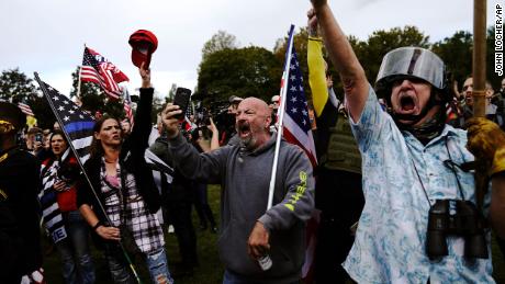 Members of the Proud Boys and other right-wing demonstrators rally Saturday in Portland.