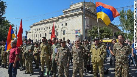 Servicemen and volunteers gather in Yerevan, Armenia, on Sunday after the Armenian government imposed martial law and ordered a general military mobilization due to clashes with Azerbaijan. 