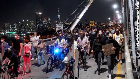 Black Lives Matter protesters from different races marched from the Barclays Center to the Brooklyn Bridge on Saturday night.