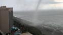 Beachgoers scramble as tornado moves up popular US beach