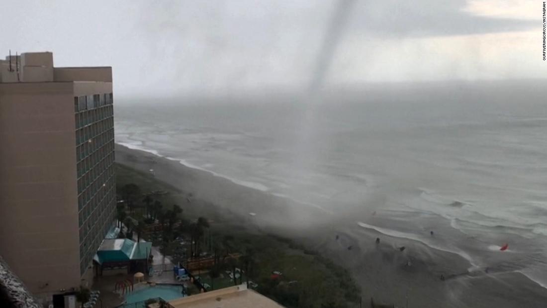 Beachgoers scramble as tornado moves up popular US beach CNN Video