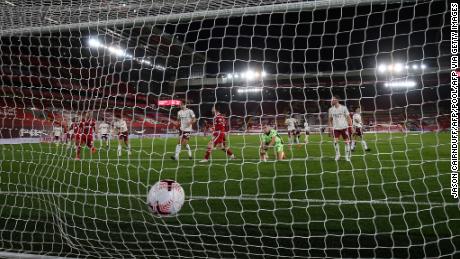 The ball hits the back of the net after Liverpool&#39;s Andrew Robertson scores his team&#39;s second goal against Arsenal.