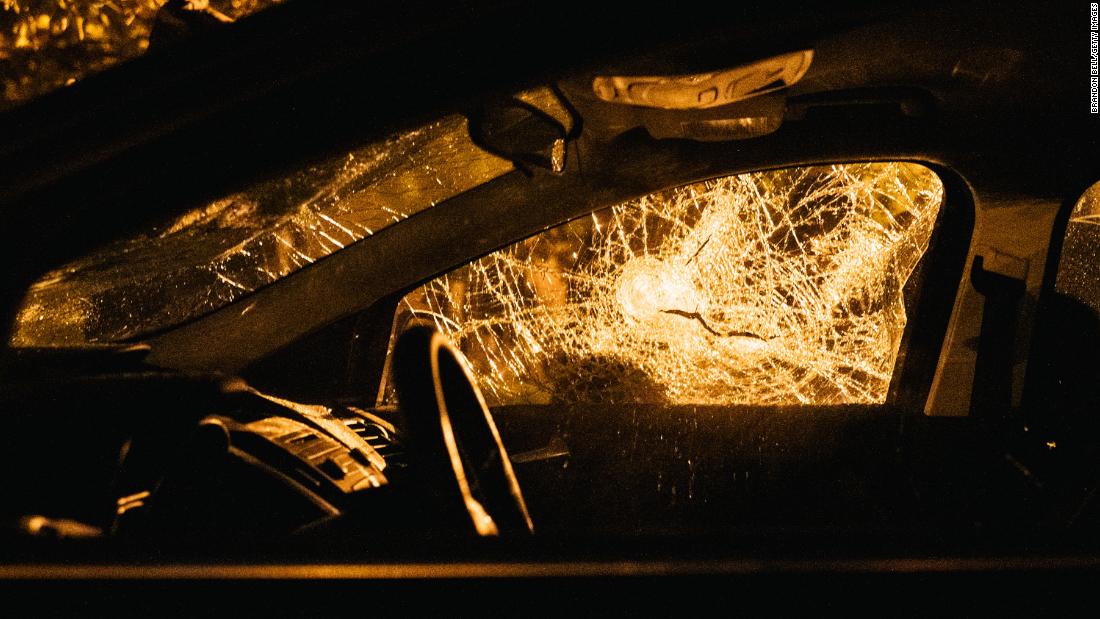 A car window is smashed following protests in Louisville, Kentucky, on September 26. Mayor Greg Fischer mandated a city-wide curfew restricting protestors from gathering between the hours of 9 p.m. to 6:30 a.m.