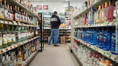  A customer gets rung out at Friendly Discount liquor store in Westbrook on Wednesday, April 22, 2020. 