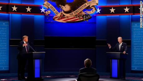 President Donald Trump, left, and Democratic presidential candidate former Vice President Joe Biden, right, with moderator Chris Wallace, center, of Fox News during the first presidential debate Tuesday, Sept. 29, 2020, at Case Western University and Cleveland Clinic, in Cleveland, Ohio. (AP Photo/Patrick Semansky)