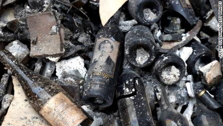 Damaged bottles of wine lay on the floor at Fairwinds Estate Winery that was destroyed by the Glass Fire.