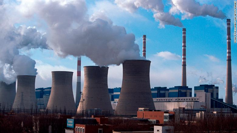 A coal-fired power plant spews steam and smoke into the air in Daqi, Inner Mongolia, China.