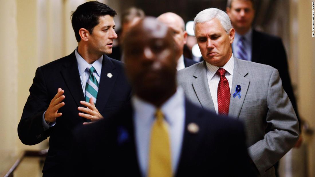 Pence walks with House Budget Committee Chairman Paul Ryan as they head to a meeting in July 2011.