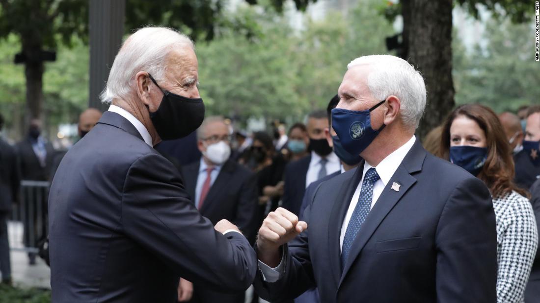 Pence greets his predecessor, Joe Biden, during a 9/11 memorial service in New York in September 2020. Biden is also the Democratic Party&#39;s presidential nominee.