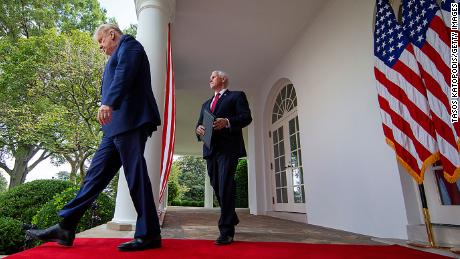 WASHINGTON, DC - SEPTEMBER 28: U.S. President Donald Trump followed by VIce President Mike Pence walk up to deliver an update on the nations coronavirus testing strategy in the Rose Garden of the White House on September 28, 2020 in Washington, DC. As the totals in the US reaches more than 7.1 million confirmed cases and 204,000 deaths, globally, there has been more than 33.1 million cases and more than 998,000 million fatalities according to John Hopkins University data.  (Photo by Tasos Katopodis/Getty Images)
