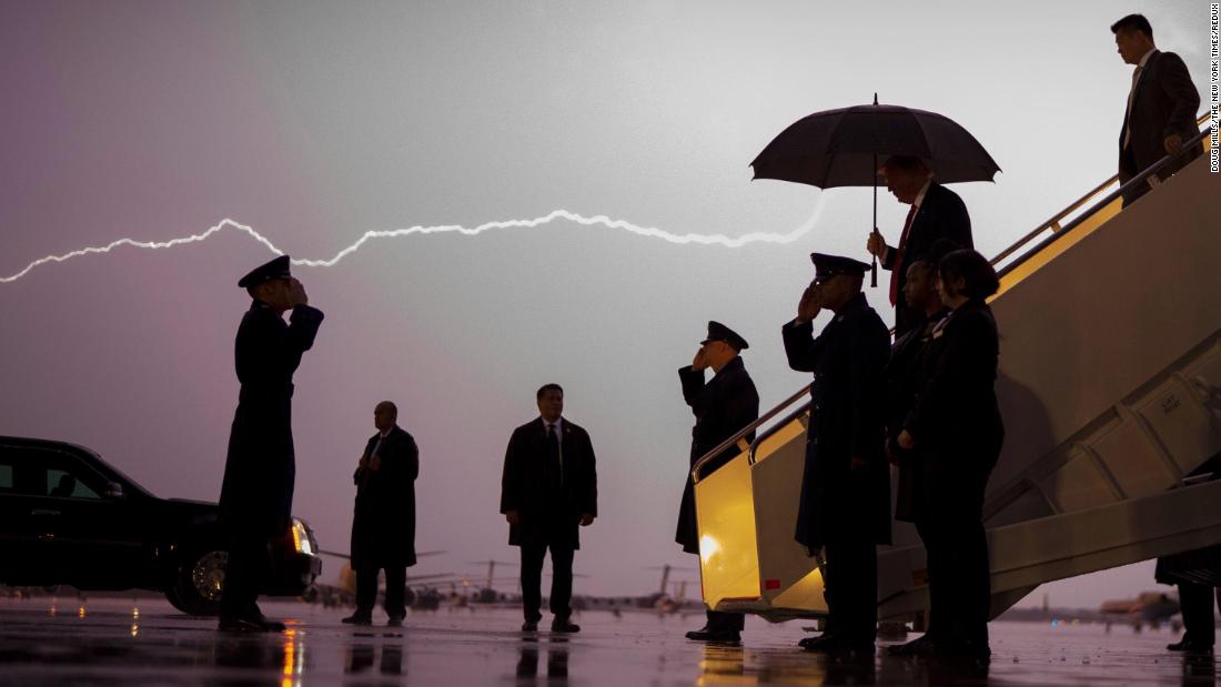 Lightning flashes as Trump exits Air Force One in August 2020. He was returning from a campaign rally in Londonderry, New Hampshire.