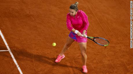 Halep returns the ball to Anisimova during their third round match at the French Open.