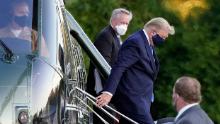 President Donald Trump arrives at Walter Reed National Military Medical Center, in Bethesda, Md., Friday, Oct. 2, 2020, on Marine One helicopter after he tested positive for COVID-19. White House chief of staff Mark Meadows is at second from left. (AP Photo/Jacquelyn Martin)