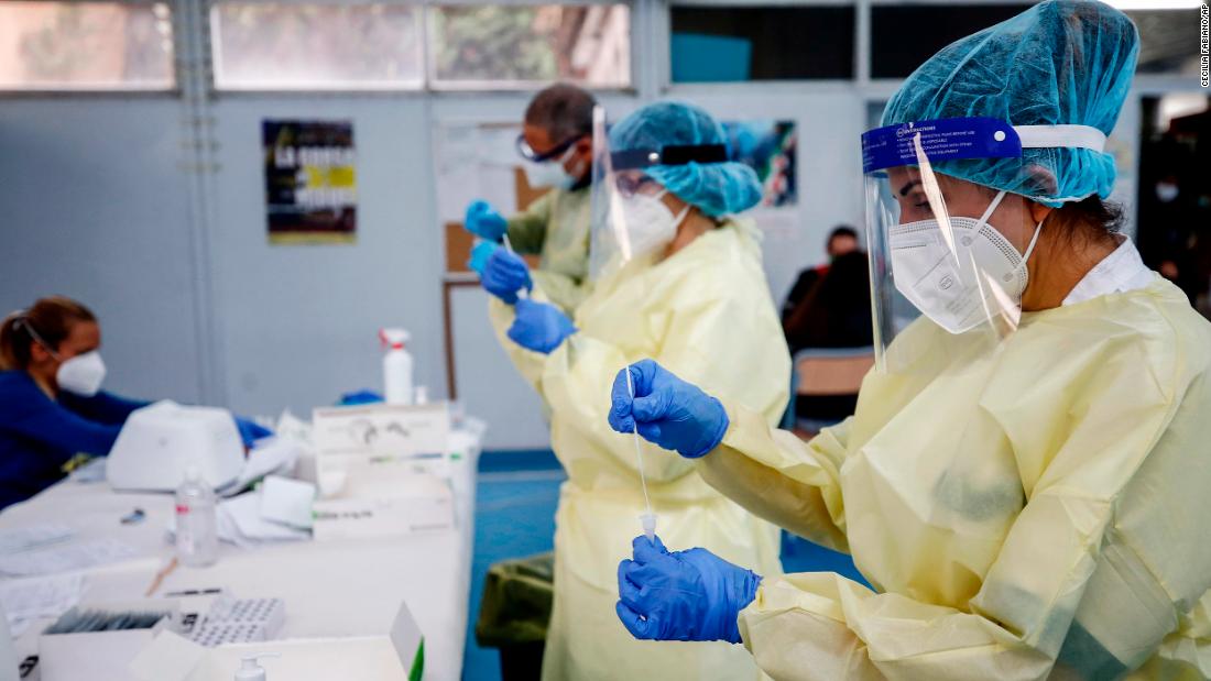 Medical staff hold swabs for rapid Covid-19 tests at a high school in Rome on September 28. 