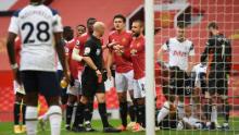 Anthony Taylor shows Manchester United's Anthony Martial a red card.