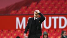 Solskjaer walks off the pitch following his side's defeat. 