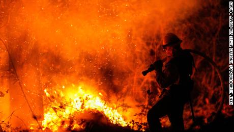 Firefighters perform structure protection against the Glass Fire in Napa County.