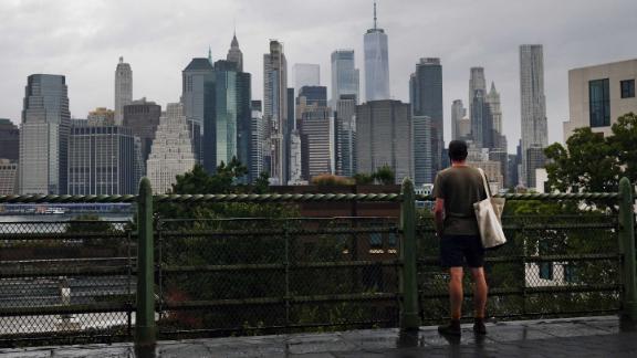 NEW YORK, NEW YORK - SEPTEMBER 29: A man looks out at the Manhattan skyline in a Brooklyn neighborhood on September 29, 2020 in New York City. New York City faces a severe financial crisis as unemployment has risen to 16% and thousands of wealthy residents who make up a vital tax base have fled the city. New York City lost 24,000 residents to Coved-19, more than any other city in America and one of the highest metropolitan losses in the world. Vital sectors like tourism, retail and cultural activities are still struggling as the city attempts to get past the epidemic. (Photo by Spencer Platt/Getty Images)
