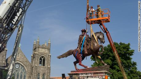 A construction crew takes down the statue of Confederate Calvary General JEB Stuart, along Monument Avenue on July 7, 2020 in Richmond, Virginia. The Andrew W. Mellon Foundation on Wednesday announced it is dedicating $250 million over the next five years to help &quot;transform the way our country&#39;s histories are told in public spaces.&quot;