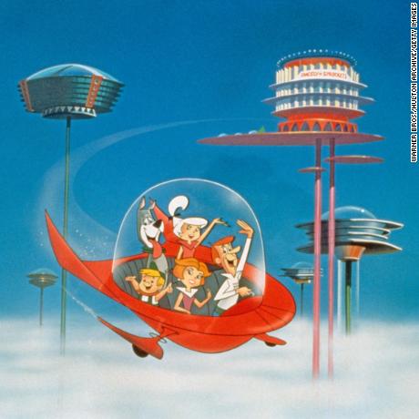 The Jetson family wave as they fly past buildings in space in their spaceship in a still from the animated television series, &#39;The Jetsons,&#39; circa 1962. (Photo by Warner Bros./Courtesy of Getty Images)