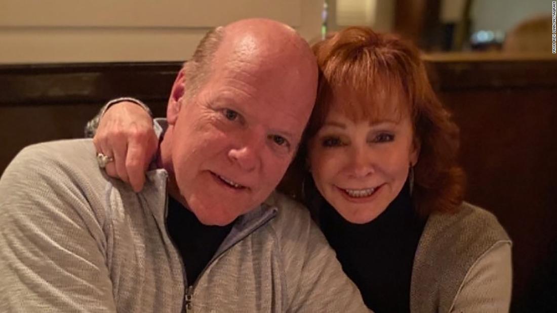 Reba McEntire warns fans after she and her boyfriend contracted breakthrough Covid-19