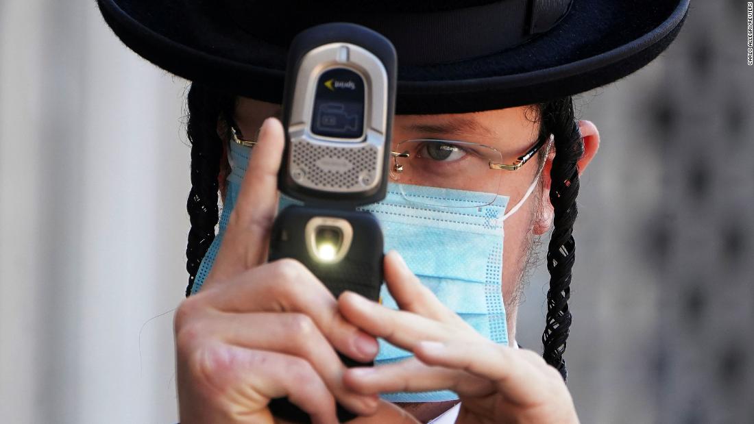 An Orthodox Jewish man takes photos of a photographer with his cell phone &lt;a href=&quot;http://www.cnn.com/2020/10/07/us/new-york-protest-orthodox-jews/index.html&quot; target=&quot;_blank&quot;&gt;during protests in New York&lt;/a&gt; on October 6. Members of the Orthodox Jewish community protested after the state announced new coronavirus-related restrictions.