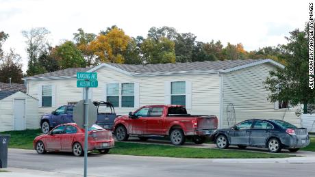 Vehicles are seen outside of a Hartland Township mobile home park the FBI searched late Wednesday night and into the morning in connection of a plot to kidnap Michigan Gov. Gretchen Whitmer.