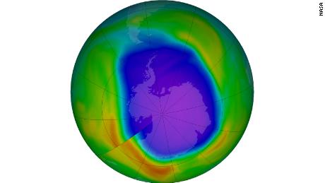 A NASA false-color view shows the total ozone over the Antarctic pole. The purple and blue colors indicate where the least ozone is, and the yellows and reds are where there is more ozone.