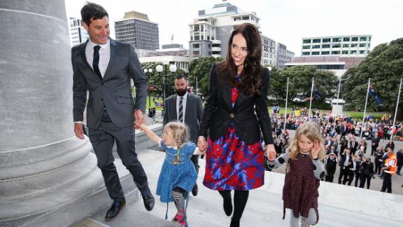 Prime Minister Jacinda Ardern, her partner Clarke Gayford, and Gayford's nieces Rosie and Nina Cowan arrive at Parliament after a swearing-in ceremony at Government House on October 26, 2017.