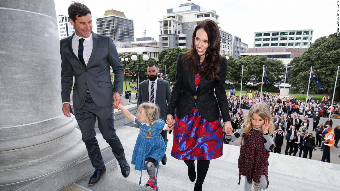 Prime Minister Jacinda Ardern, her partner Clarke Gayford, and Gayford&#39;s nieces Rosie and Nina Cowan arrive at Parliament after a swearing-in ceremony at Government House on October 26, 2017.