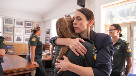 Jacinda Ardern hugs a first responder from the St John's ambulance team that helped those injured in the White Island volcano eruption on December 9, 2019. 