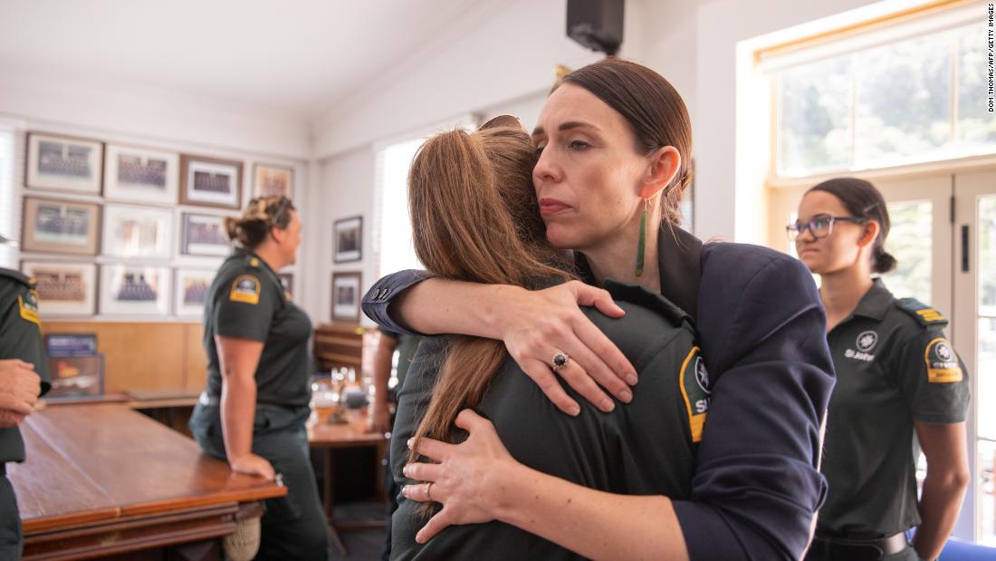 Jacinda Ardern hugs a first responder from the St John&#39;s ambulance team that helped those injured in the White Island volcano eruption on December 9, 2019. 