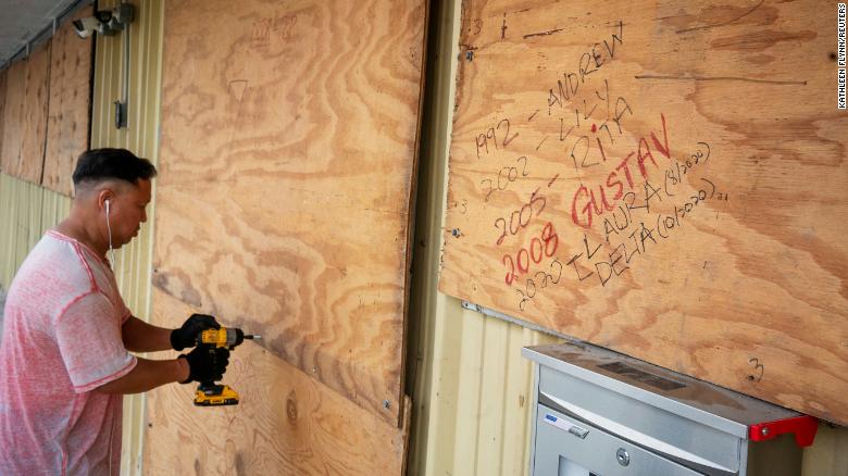 Bang Bui prepares his business Handy Mart as Hurricane Delta approaches in Abbeville, Louisiana Thursday