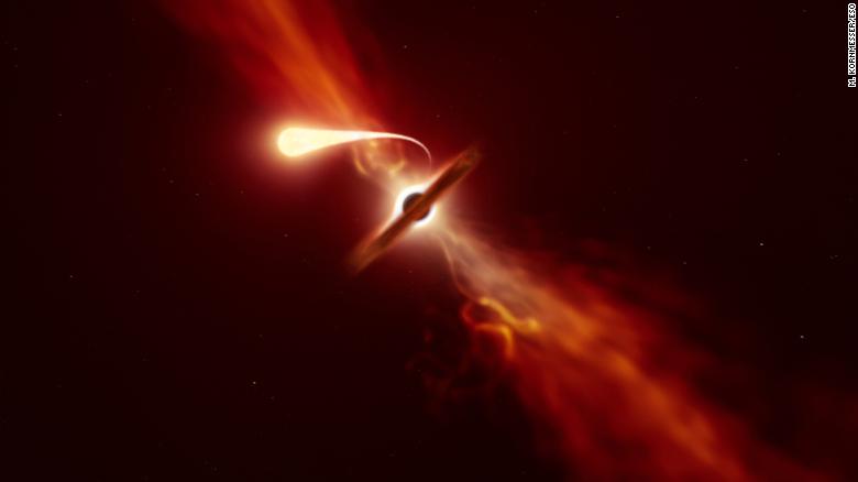 This illustration depicts a star (in the foreground) experiencing spaghettification as it&#39;s sucked in by a supermassive black hole (in the background) during a &quot;tidal disruption event.&quot; 