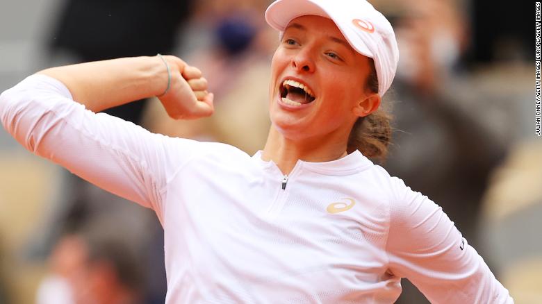 Iga Swiatek of Poland celebrates after winning the women&#39;s singles final at the French Open in Paris against Sofia Kenin of the United States.