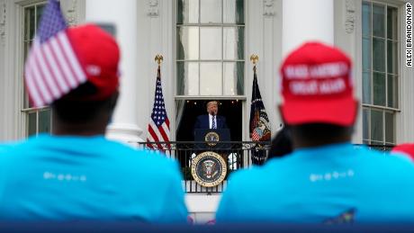 President Donald Trump speaks from the Blue Room Balcony of the White House to a crowd of supporters, Saturday, Oct. 10, 2020, in Washington. (AP Photo/Alex Brandon)