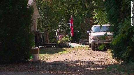 The truck next to the house flying the Confederate flag had an upside-down Stars and Stripes on its antenna.