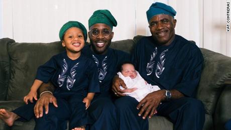 Lead study author Olajide N. Bamishigbin Jr. (second from left) with his father and two sons shortly after the birth of his second child.