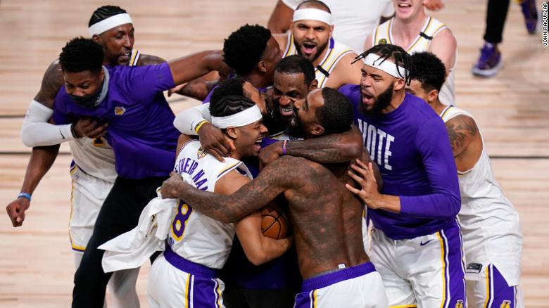 The Los Angeles Lakers celebrate after defeating the Miami Heat 106-93 in Game 6 of the NBA Finals, winning the franchise&#39;s 17th title.