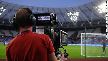 A television cameraman follows the action during the English Premier League football match between West Ham United and Newcastle United.